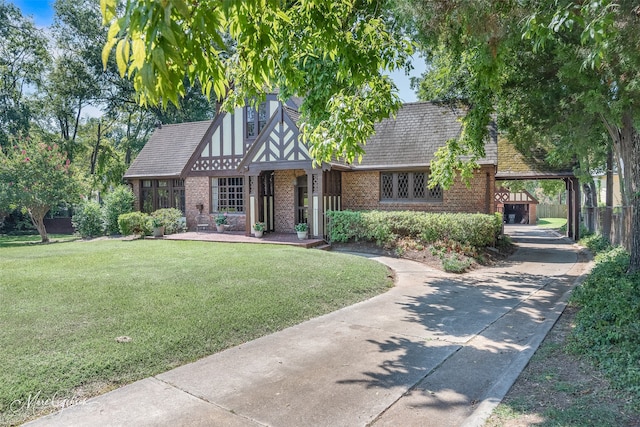 tudor-style house with a front lawn