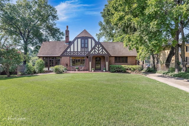 tudor house with a front lawn