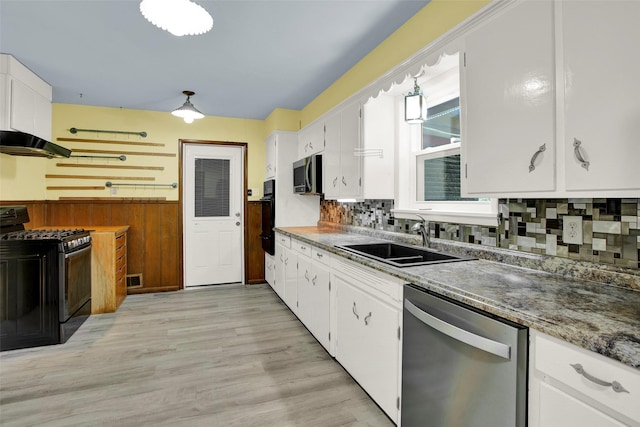 kitchen featuring decorative backsplash, white cabinetry, sink, and stainless steel appliances