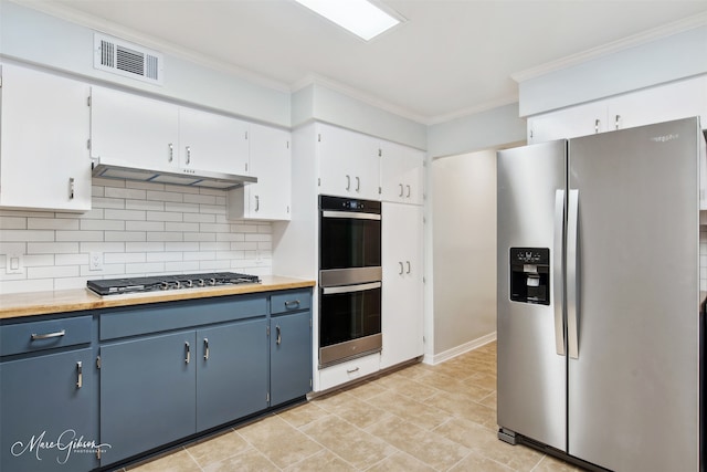 kitchen featuring blue cabinets, white cabinetry, ornamental molding, and appliances with stainless steel finishes