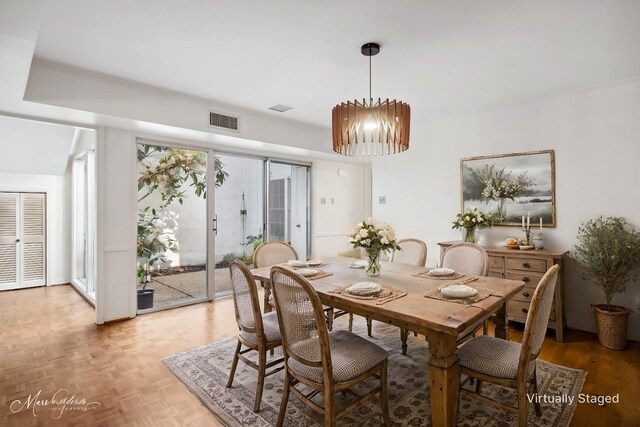 unfurnished living room with crown molding and dark parquet floors