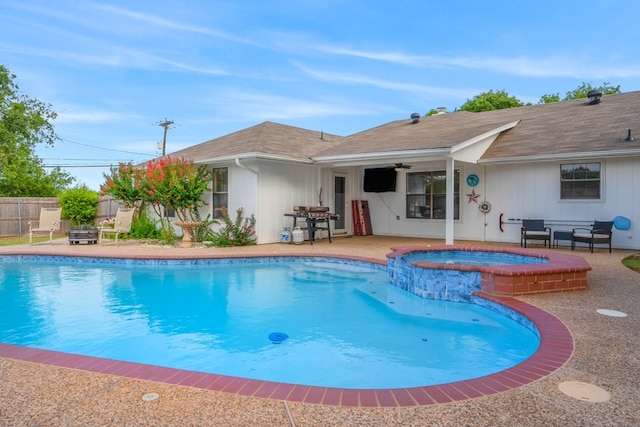 view of swimming pool featuring ceiling fan, a patio area, a grill, and an in ground hot tub