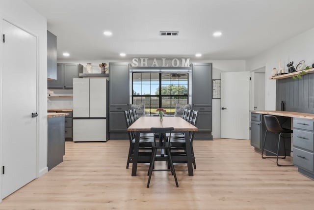 dining room with light hardwood / wood-style floors