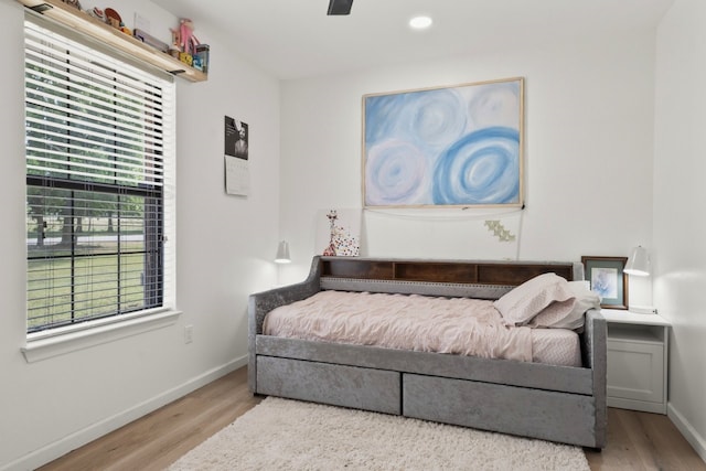 bedroom with ceiling fan and wood-type flooring