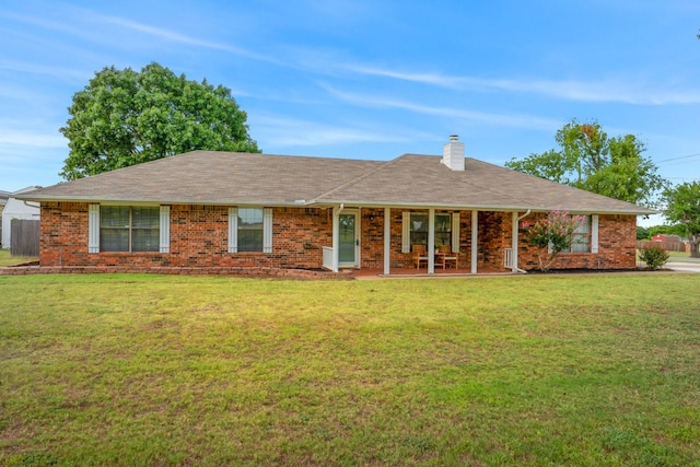 ranch-style house featuring a front lawn