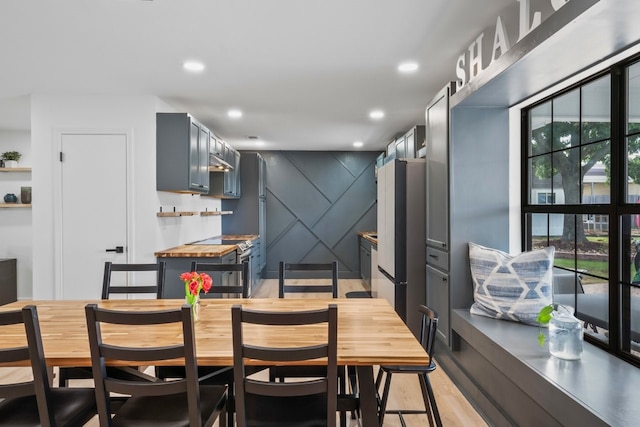 dining space featuring light wood-type flooring