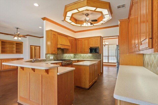 kitchen with appliances with stainless steel finishes, dark tile patterned floors, premium range hood, a kitchen island, and decorative backsplash