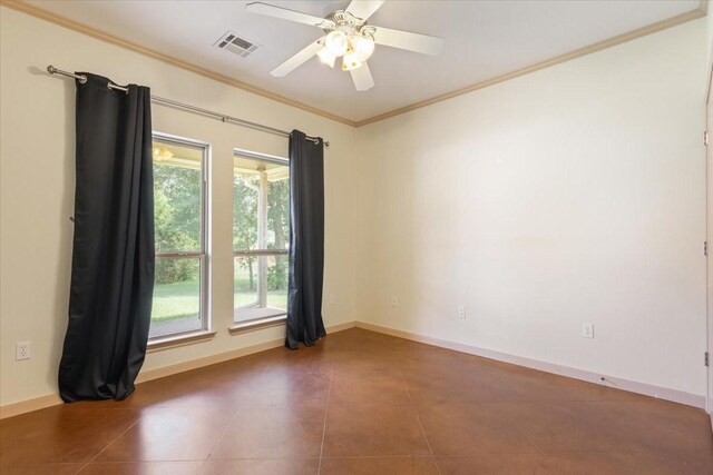 spare room with ornamental molding, tile patterned floors, and ceiling fan