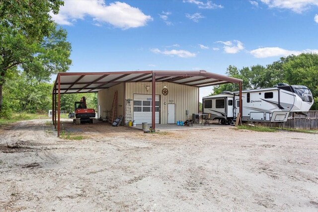 view of outbuilding with a carport