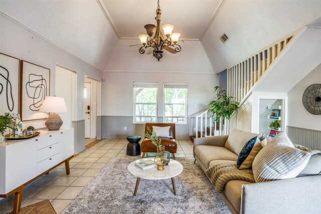 tiled living room featuring a chandelier and vaulted ceiling