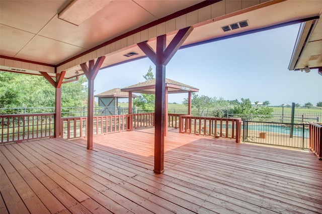 wooden deck featuring a fenced in pool