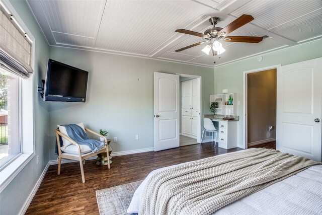 bedroom with ceiling fan, multiple windows, and dark hardwood / wood-style flooring