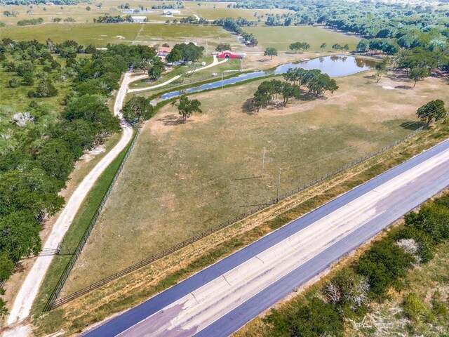 bird's eye view featuring a rural view and a water view