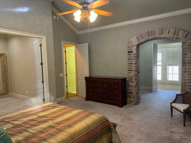 bedroom featuring ceiling fan, ornamental molding, high vaulted ceiling, and light carpet