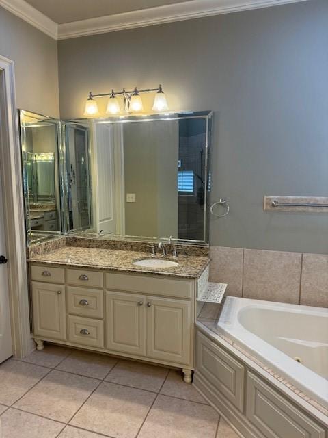 bathroom with crown molding, vanity, plus walk in shower, and tile patterned flooring