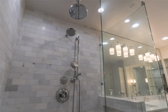 bathroom with a tile shower