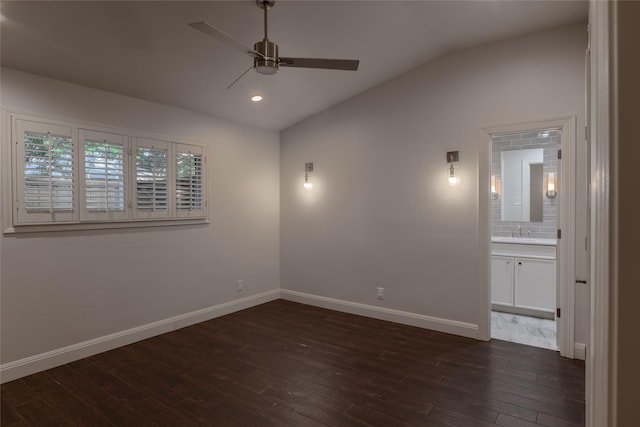 spare room with ceiling fan, sink, dark hardwood / wood-style floors, and lofted ceiling