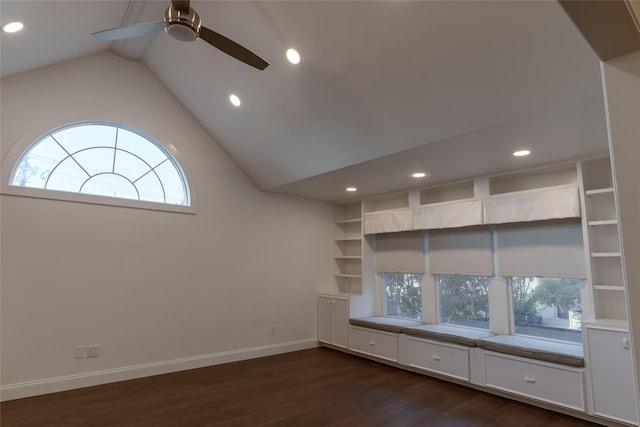 unfurnished living room featuring ceiling fan, dark hardwood / wood-style floors, built in features, and lofted ceiling