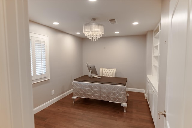 interior space with a chandelier and dark hardwood / wood-style floors