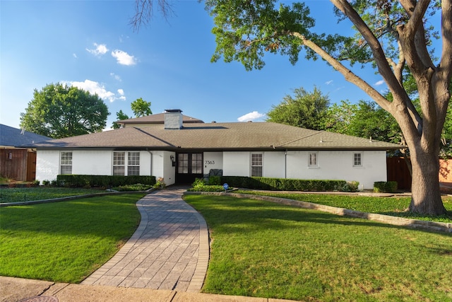 single story home with a front yard