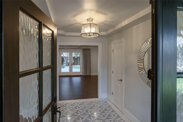 interior space with french doors and a notable chandelier