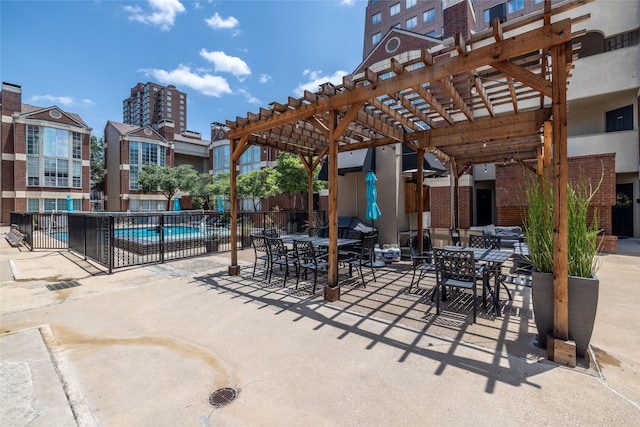 view of patio featuring a pergola and a community pool