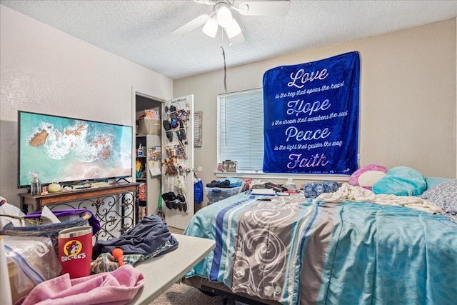 bedroom featuring a textured ceiling and ceiling fan