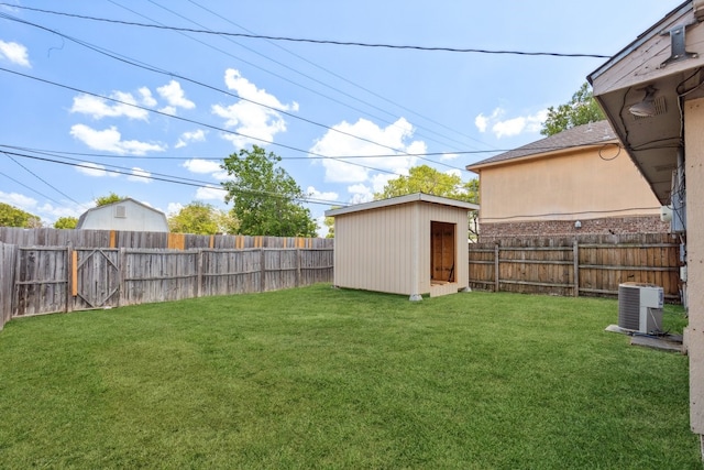 view of yard with cooling unit and a storage shed