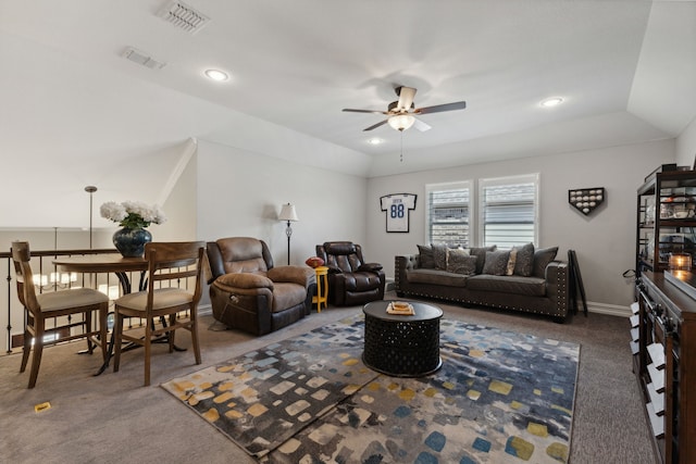 carpeted living room featuring vaulted ceiling and ceiling fan