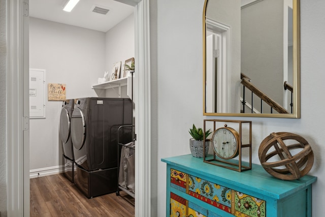 washroom featuring hardwood / wood-style floors and washer and clothes dryer