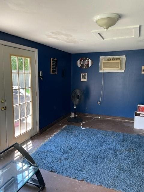 interior space featuring a wall mounted air conditioner and french doors