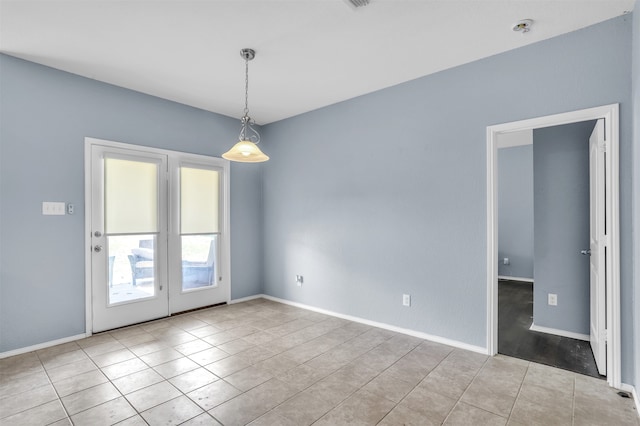 unfurnished room with light tile patterned floors