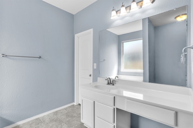 bathroom with tile patterned floors and vanity