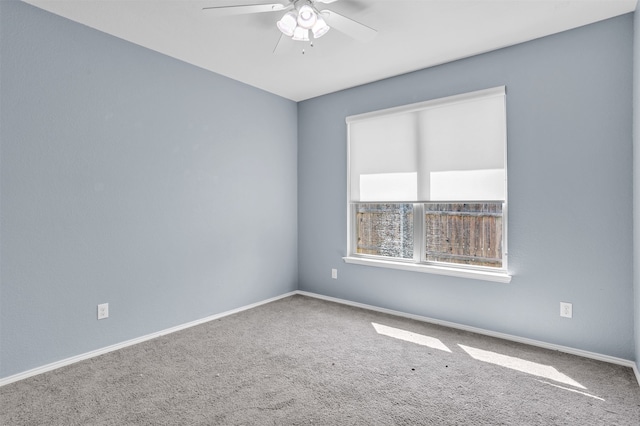 unfurnished room with ceiling fan and carpet floors