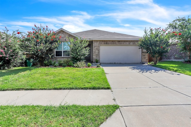 view of front of property with a front lawn and a garage