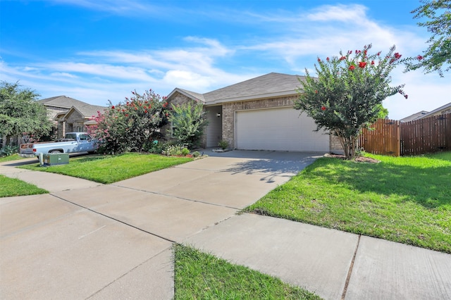 view of front of home featuring a front lawn and a garage