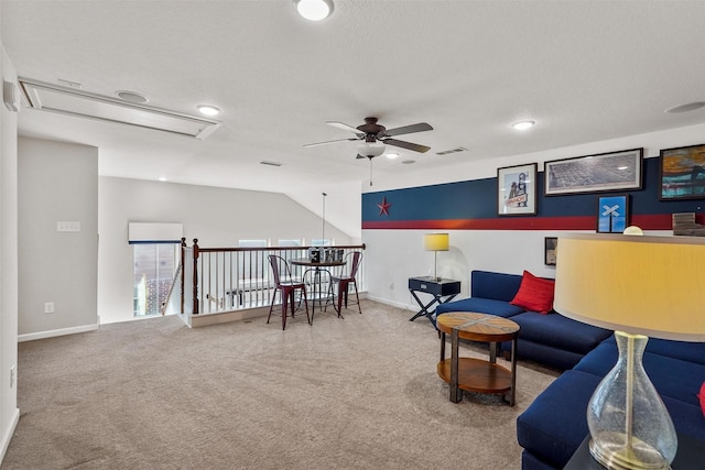 carpeted living room featuring ceiling fan, a textured ceiling, and vaulted ceiling