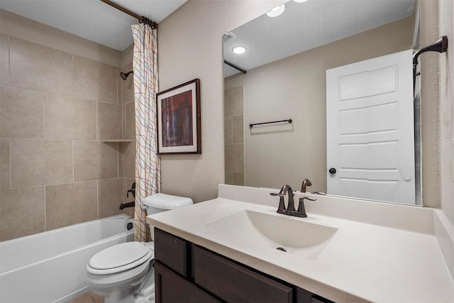 full bathroom featuring shower / bath combo with shower curtain, toilet, and vanity