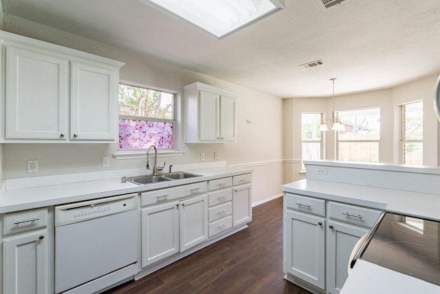 kitchen featuring pendant lighting, sink, white cabinetry, white dishwasher, and dark hardwood / wood-style flooring