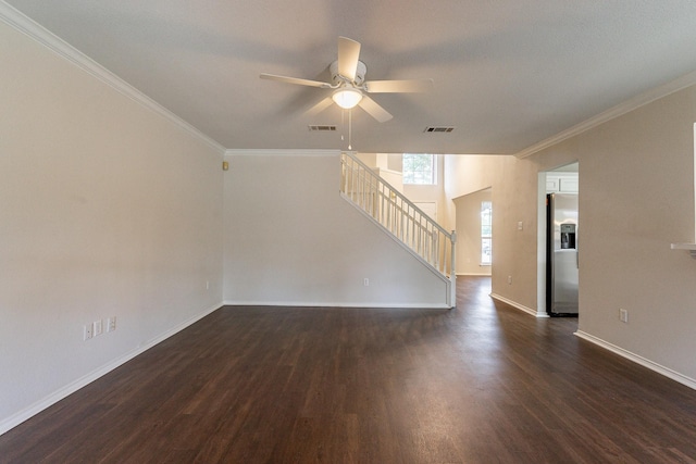 empty room with ornamental molding, ceiling fan, and dark hardwood / wood-style flooring