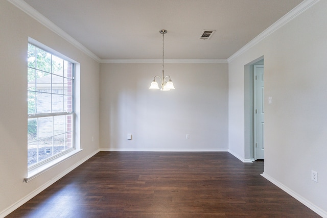 empty room with crown molding, dark hardwood / wood-style floors, and a chandelier