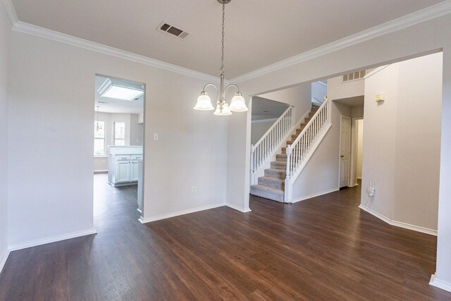 unfurnished dining area featuring ornamental molding, dark hardwood / wood-style floors, and a chandelier