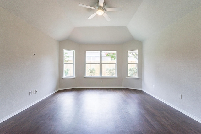 unfurnished room featuring vaulted ceiling, dark wood-type flooring, and ceiling fan