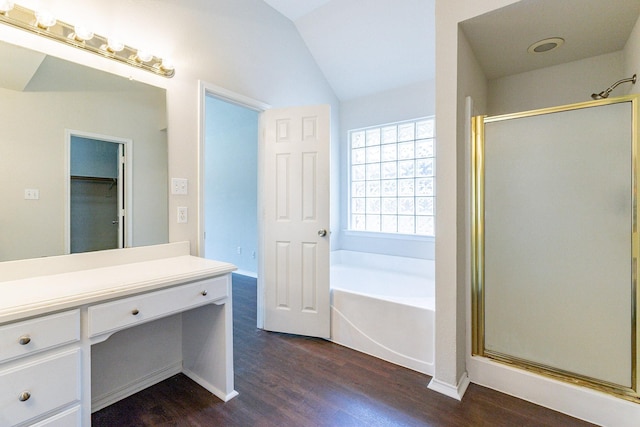 bathroom with vaulted ceiling, shower with separate bathtub, hardwood / wood-style floors, and vanity