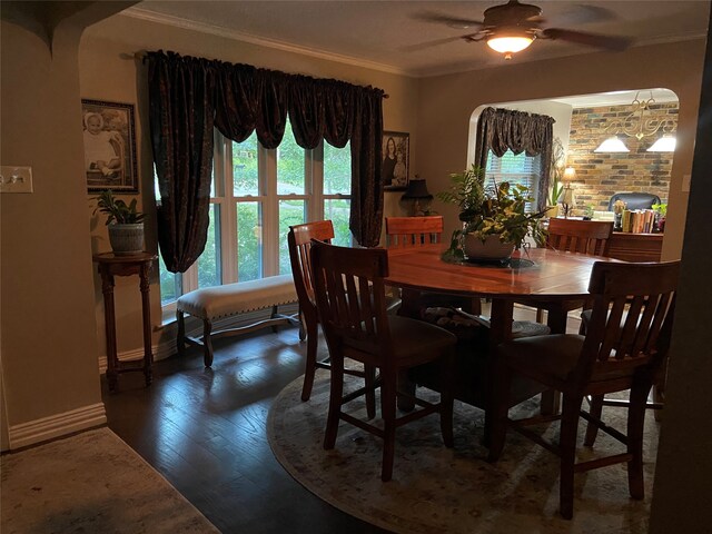 dining room with crown molding, ceiling fan, and wood-type flooring