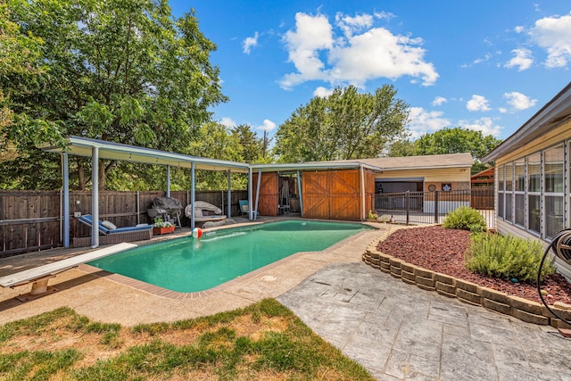 view of swimming pool featuring a patio area