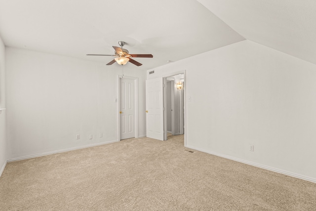 interior space featuring vaulted ceiling and ceiling fan