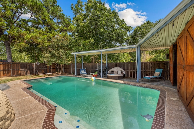 view of pool featuring a patio