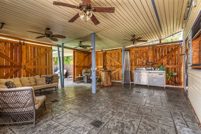 view of patio / terrace featuring ceiling fan