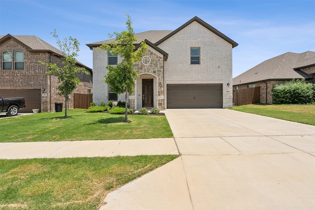 view of front of property featuring a garage and a front yard